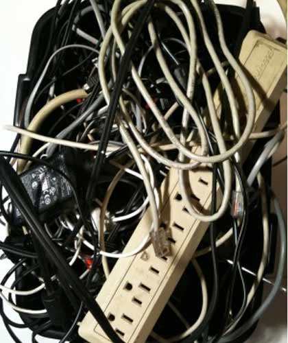 mess of cables and power strip
